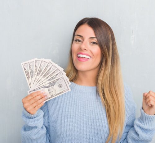 smiling woman with cash